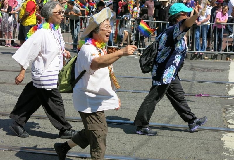 Three women march in San Francisco's Pride parade.